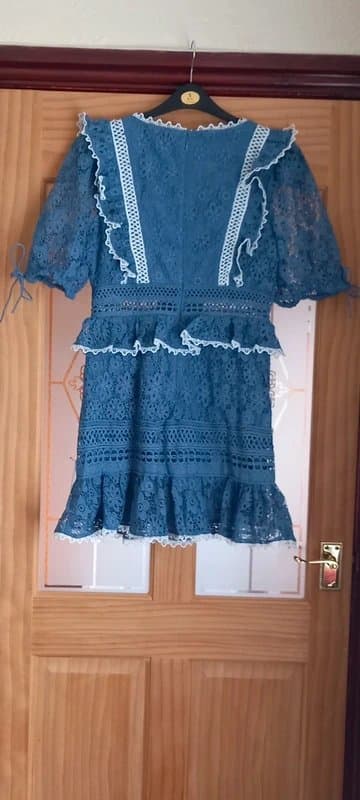 ASOS Design Stunning ladies lace mini dress with ruffle sleeve and contrast trims.