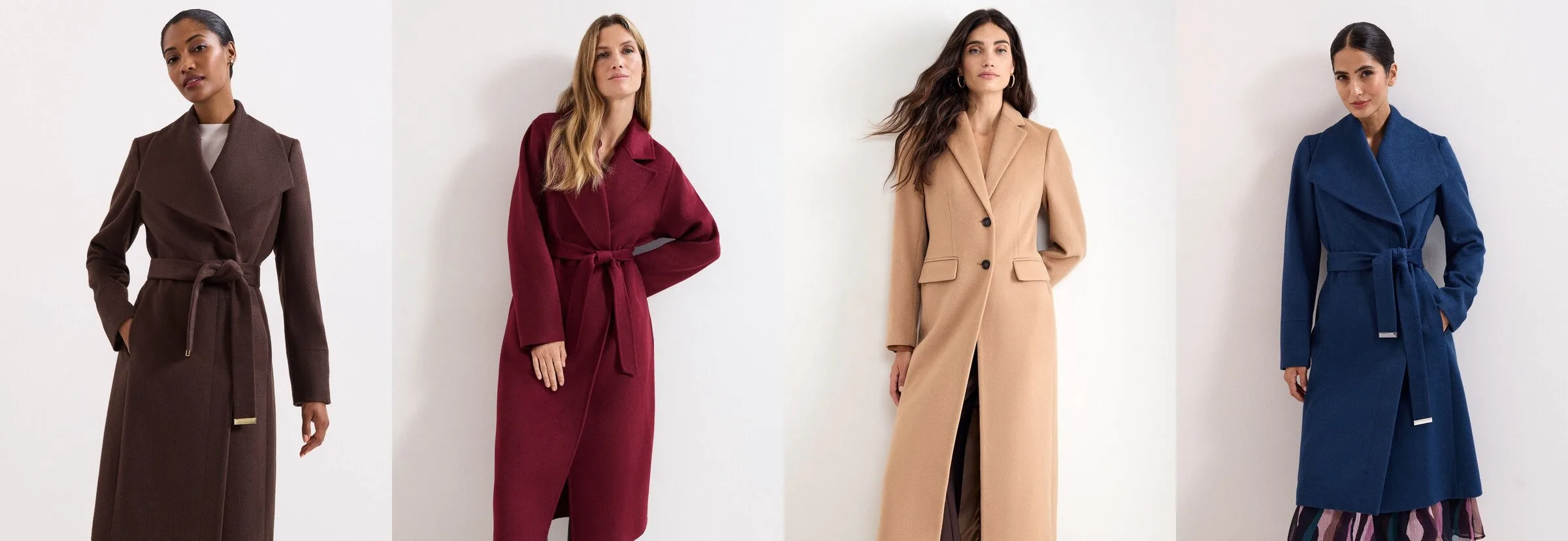 Four Phase Eight coats on models against a plain wall: a dark brown belted Nicci with a shawl collar, a wine Darcy wrap coat with a tie belt, a camel single-breasted Lydia maxi coat and a navy belted Nicci