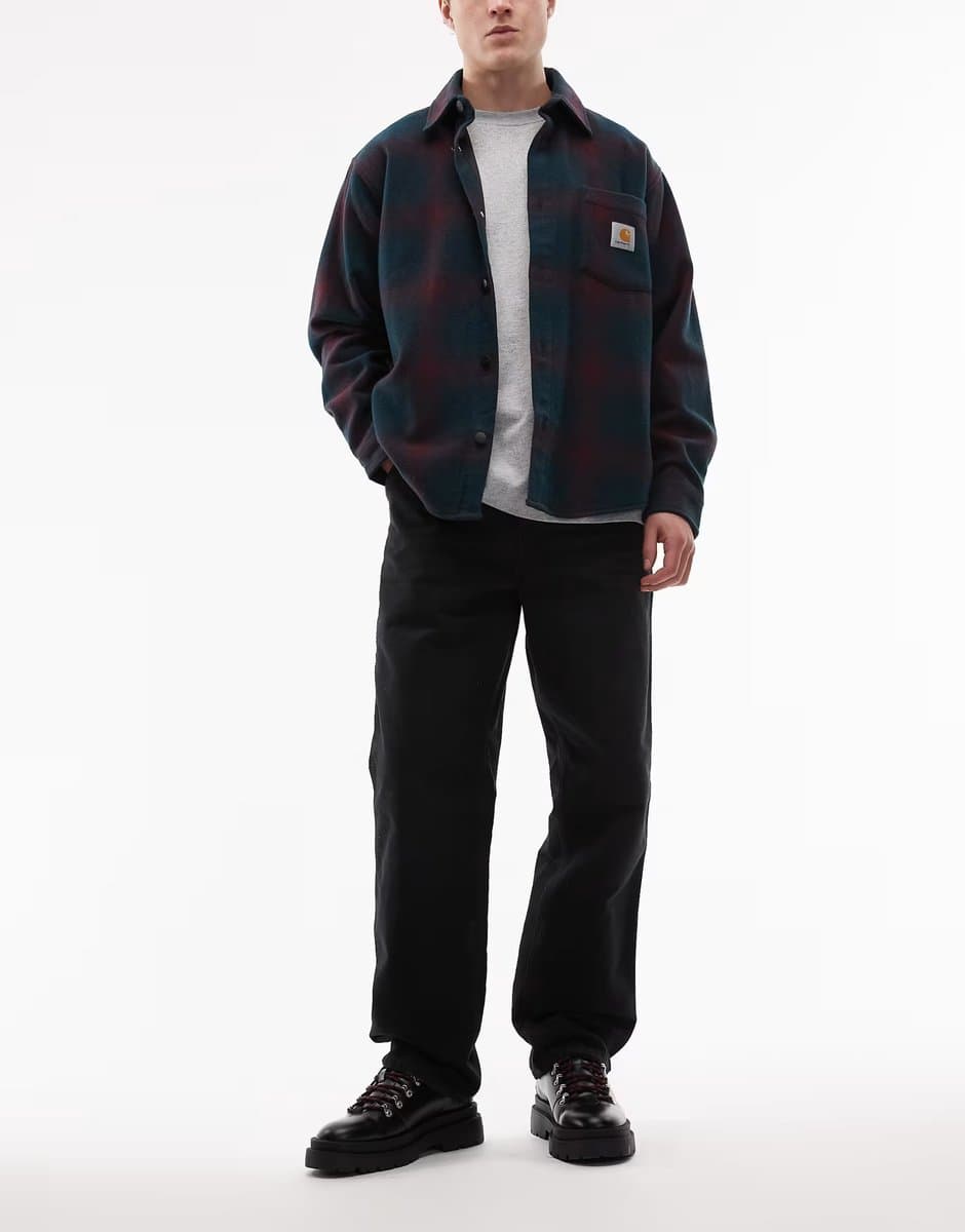 ASOS Carhartt WIP single knee straight leg trousers in black with abrasions