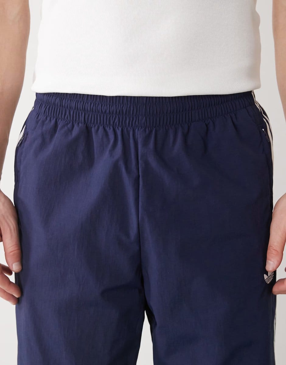 ASOS adidas Originals Firebird woven track pants in night indigo - 4