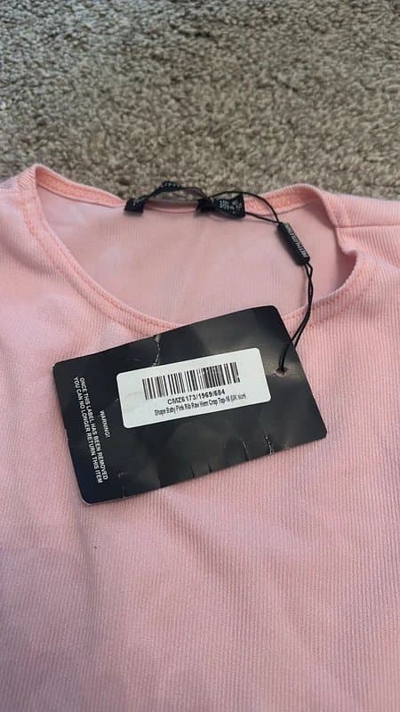 PrettyLittleThing PLT shape baby pink rib raw hem crop top and skirt
