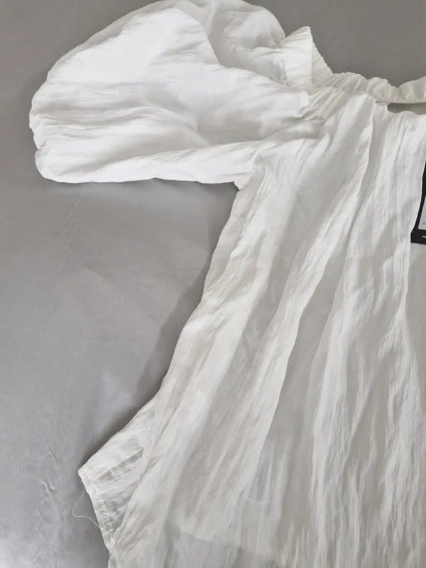 New Look New with Tags. New look white airy top with gathered neckline & balloon sleeves