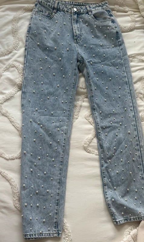Musera These light-wash denim straight-leg jeans feature an all-over faux-pearl bead embellishment.
