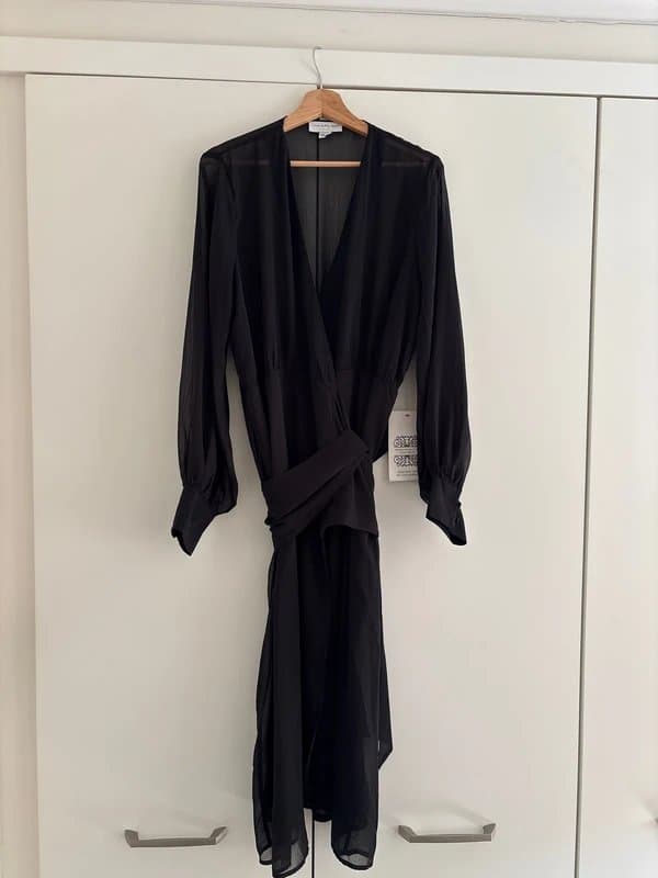 Never Fully Dressed Never fully dressed.   Wrap around dress with separate liner cami. Size 18