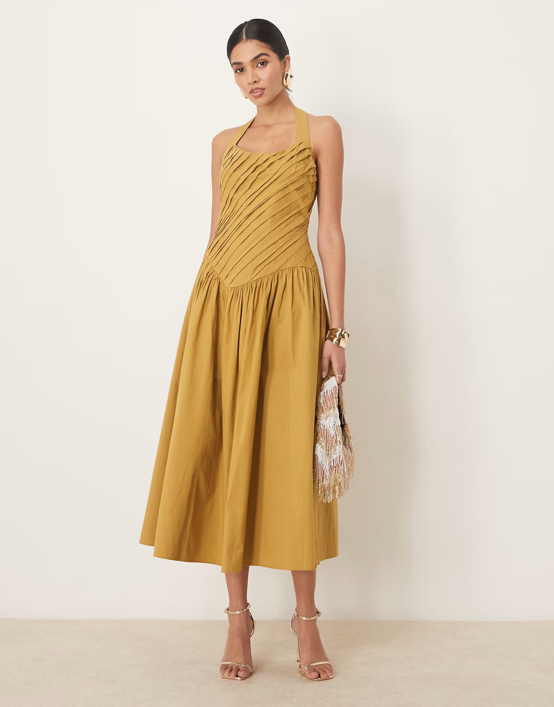 ASOS ASOS DESIGN halter neck asymmetric pleat bodice midi sundress with dropped waist in turmeric