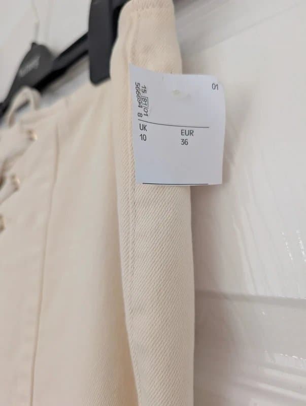 ASOS Cream flared jeans with lace up detail and zip