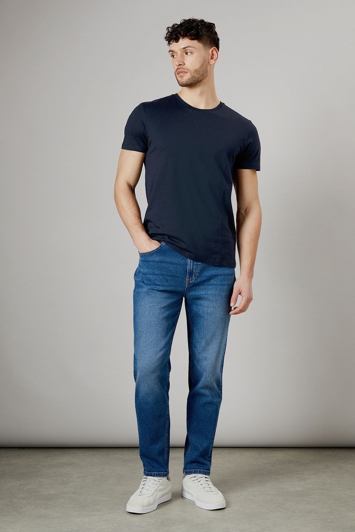 Burton Men's Mid Wash Stretch Tapered Fit Jeans in Mid Blue