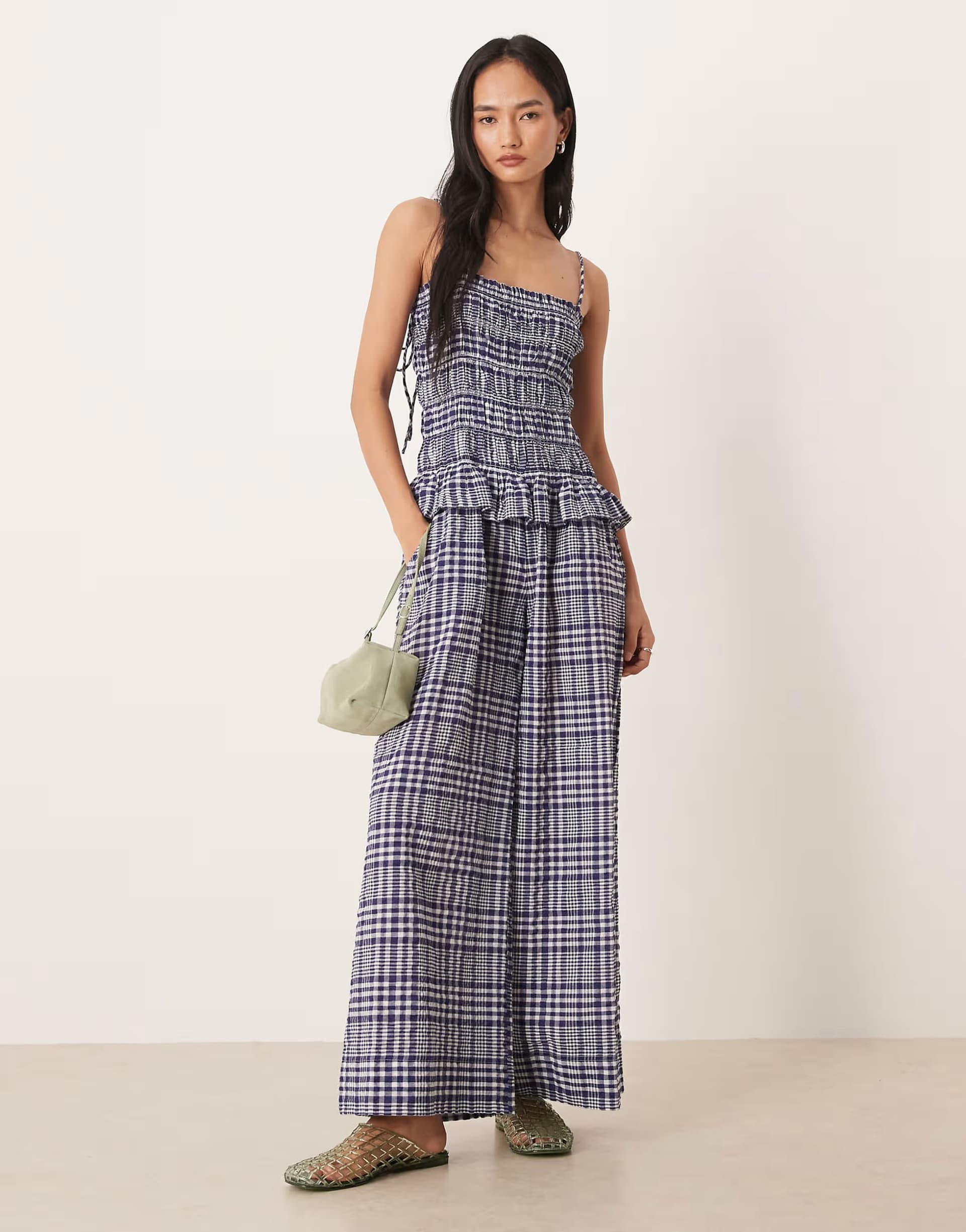 ASOS ASOS DESIGN shirred peplum jumpsuit in navy gingham