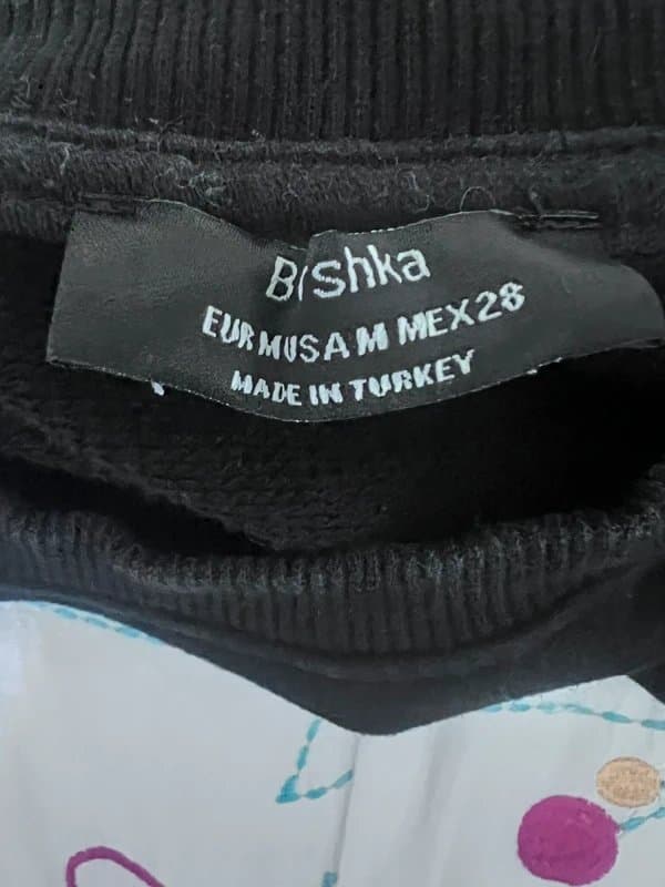 Bershka Beautiful unique black sweatshirt from Bershka featuring a striking embroidered face design Top