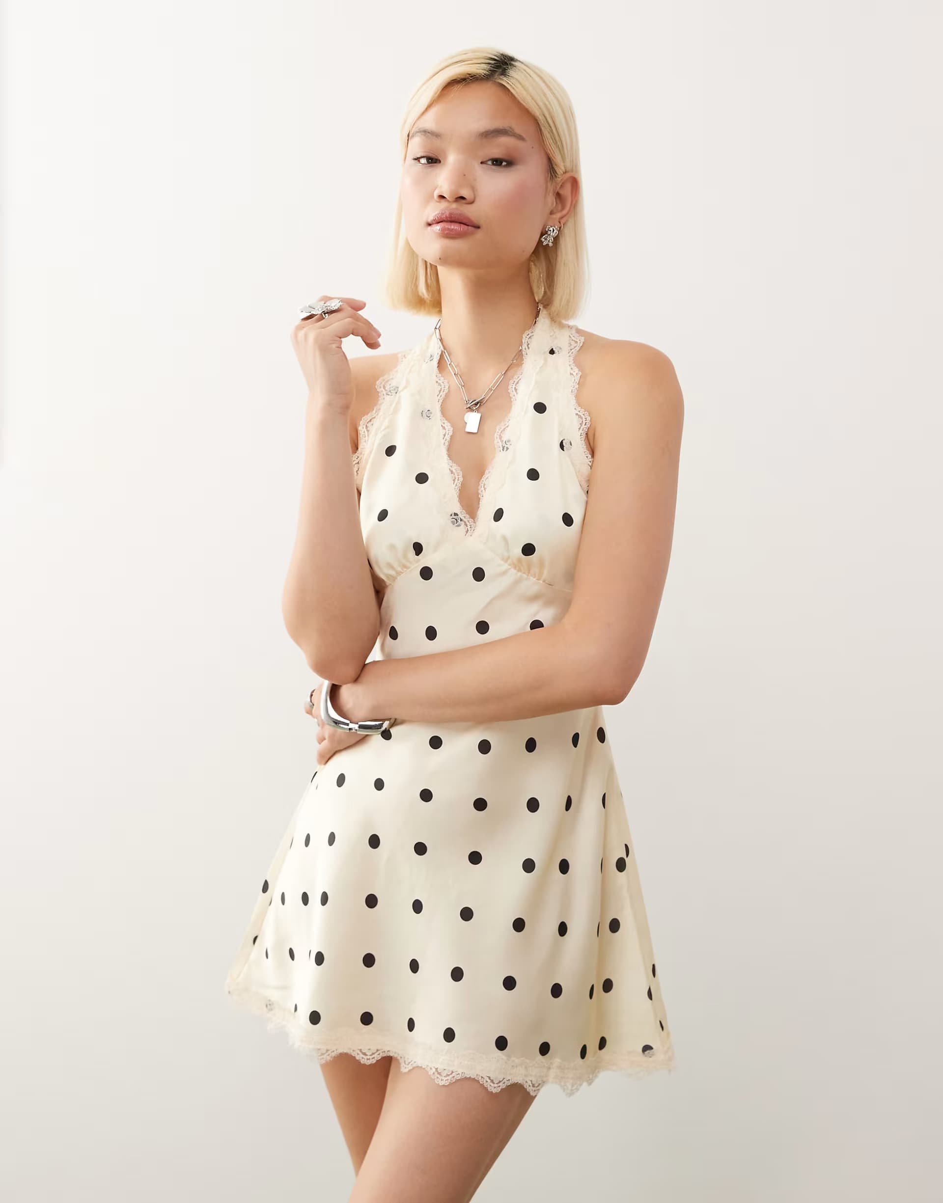 ASOS Lioness Stars Align halterneck lace trim open back satin mini dress in cream and black polka