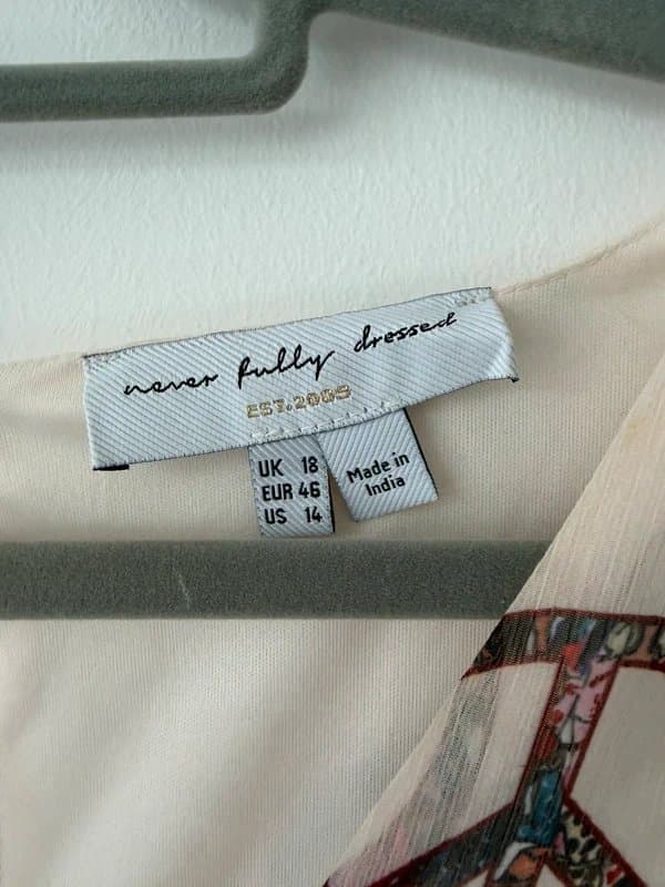 Never Fully Dressed Never fully dressed peace and love playsuit 16/18