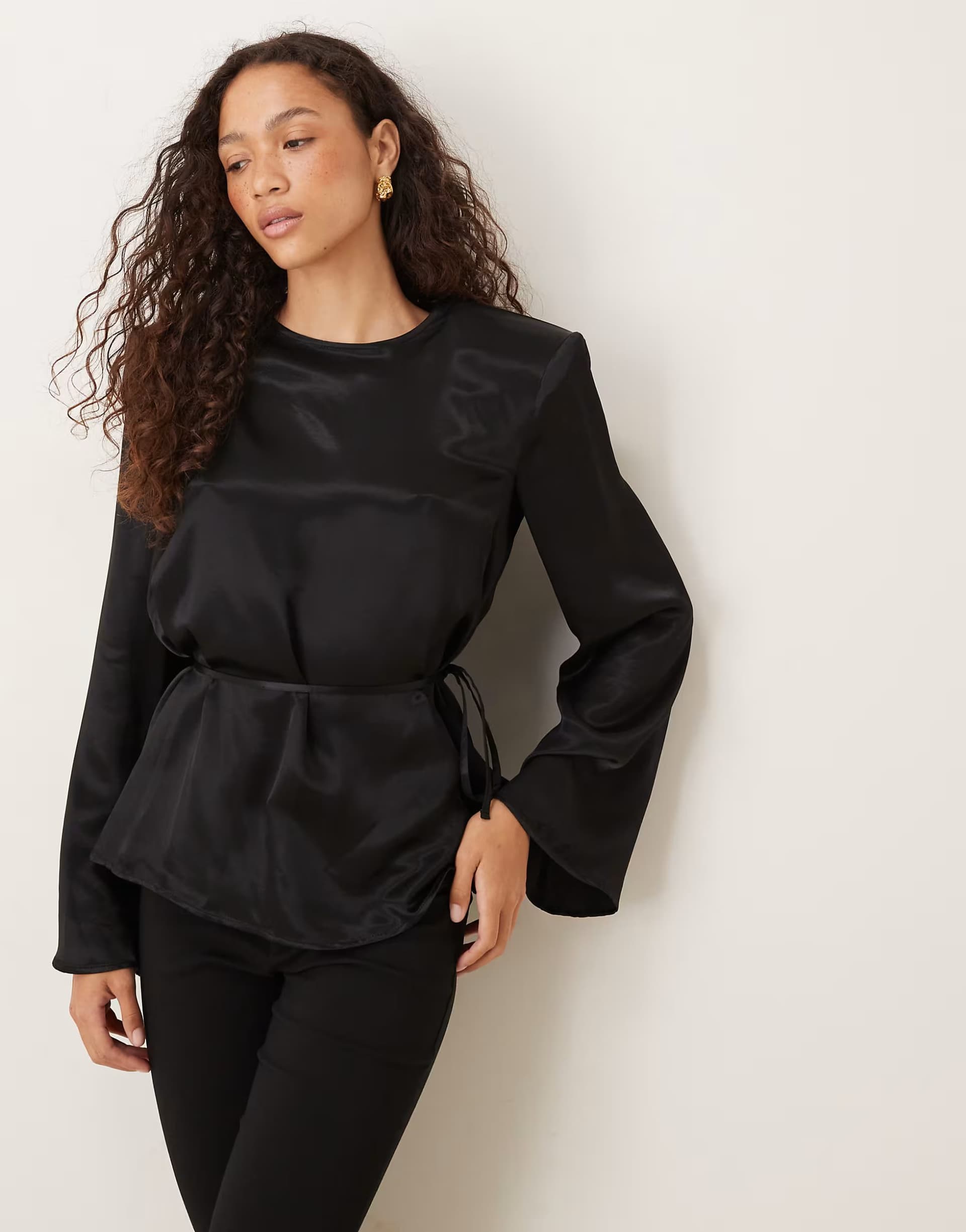 ASOS ASOS DESIGN satin blouson tie waist top with shoulder pads in black