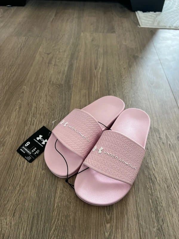 Under Armour Ladies baby pink under armour sliders size 6.5