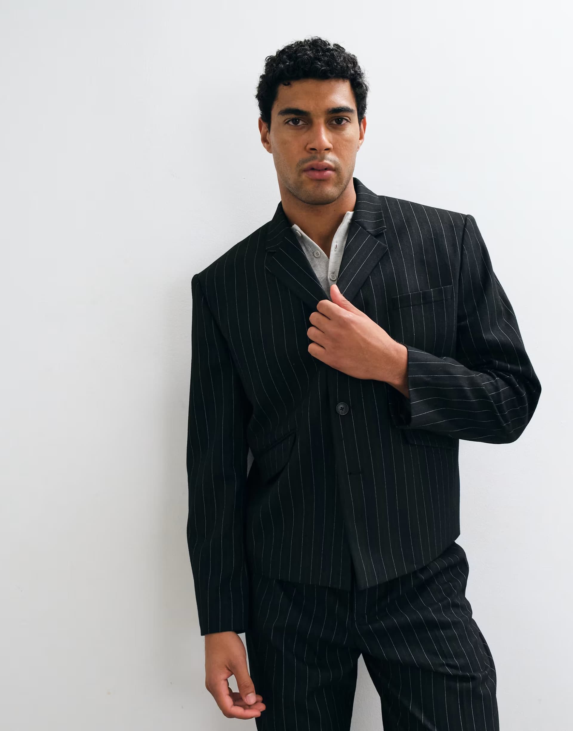 ASOS ASOS DESIGN boxy suit jacket with button detailing in black pinstripe