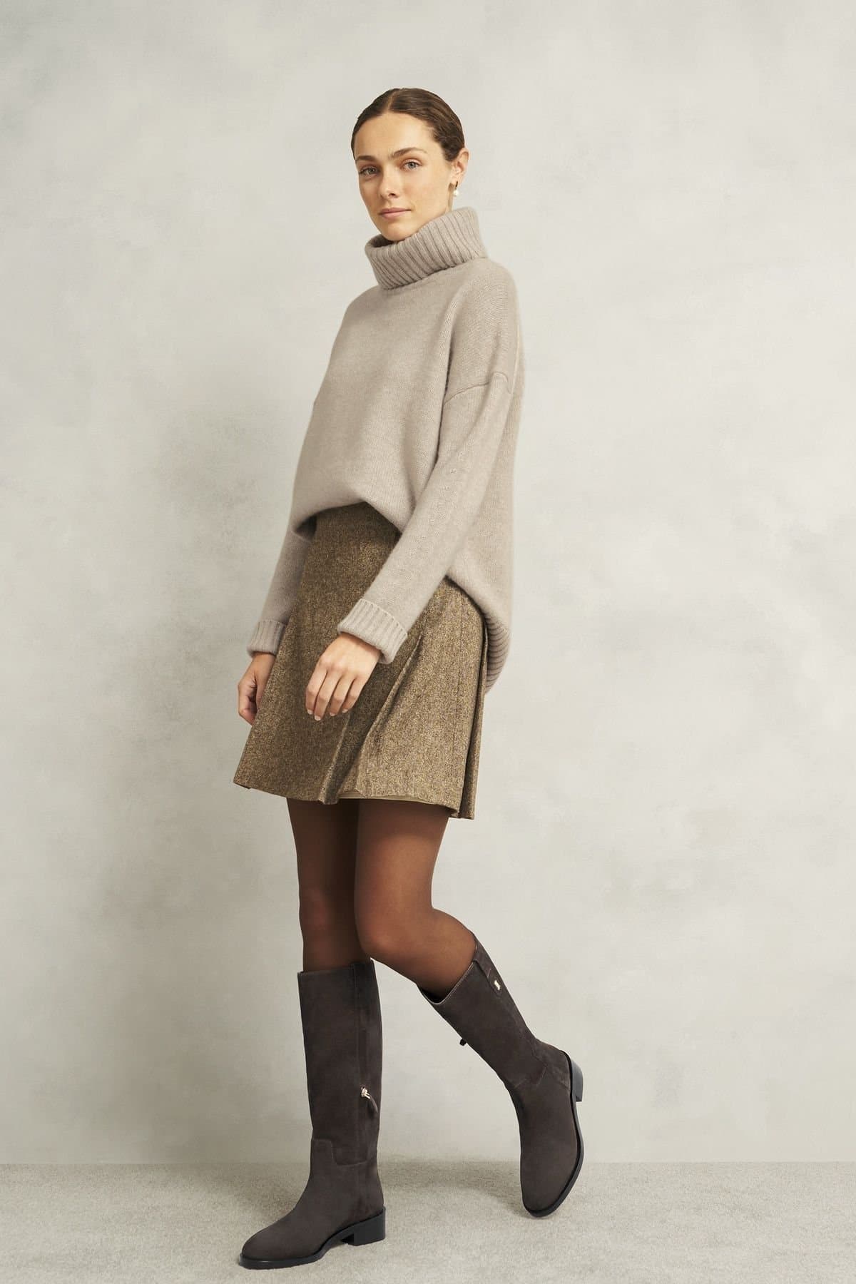 Brown riding boots with tweed mini skirt and tights
