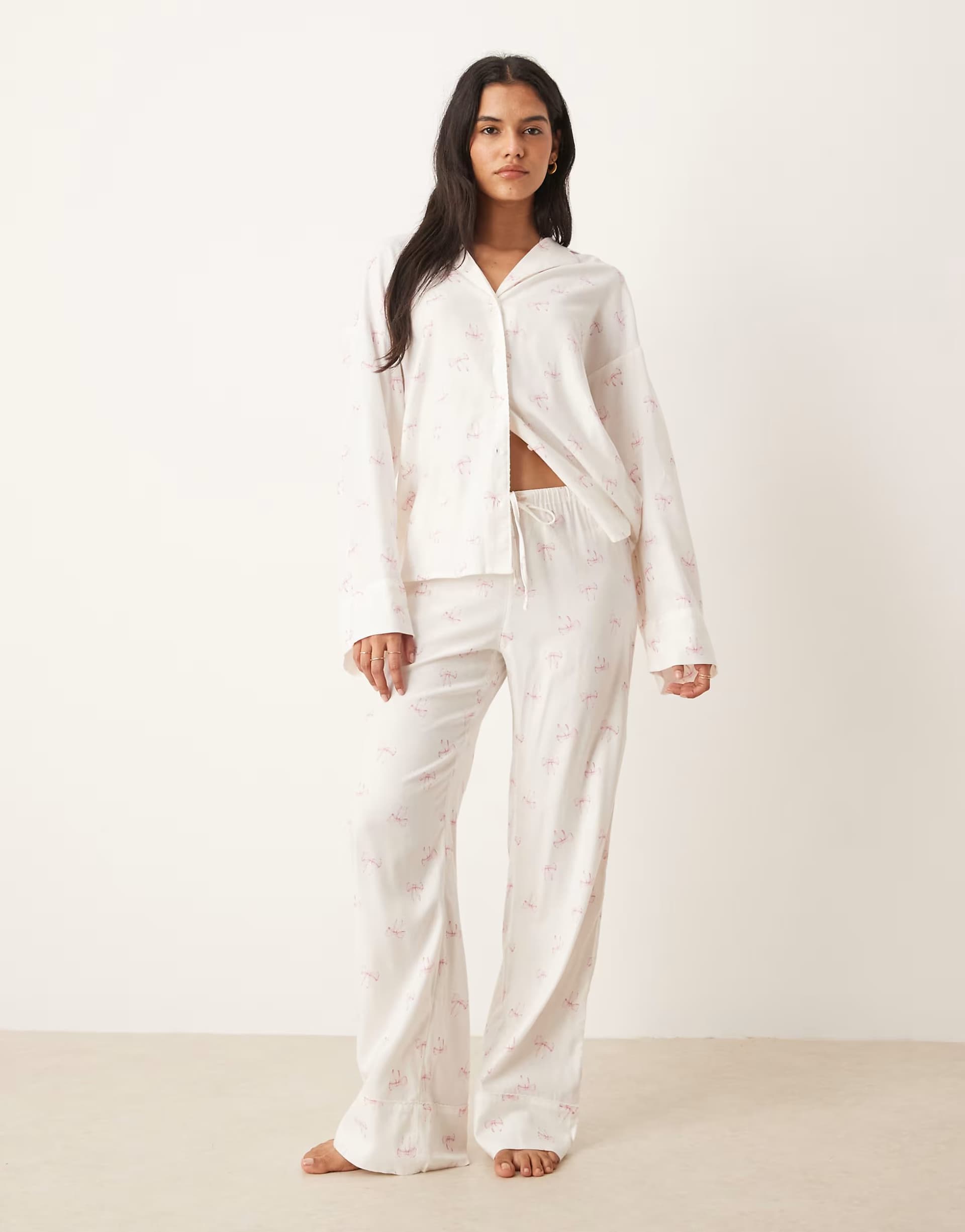 ASOS Gina Tricot mix and match flannel pyjamas trousers in white with pink bows print