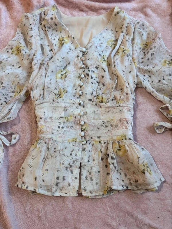 The Unbranded Brand gorgeous pastel pink floral top with a babydoll waist, ruffles, bow sleeves and buttons 10