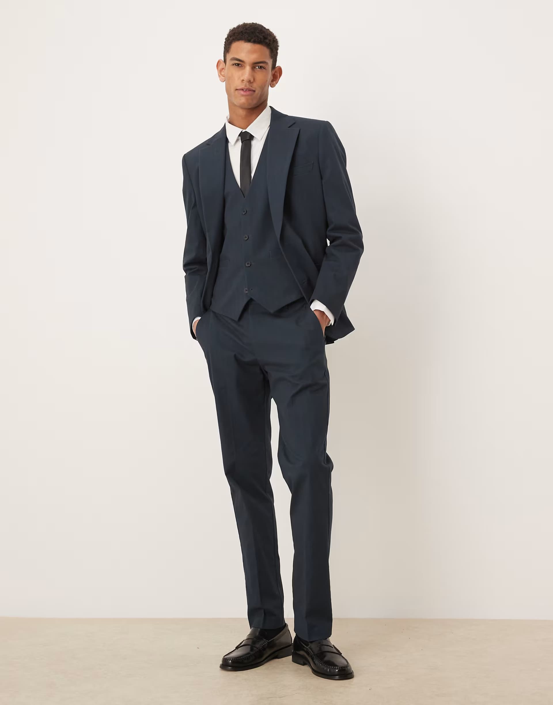 ASOS ASOS DESIGN slim suit trousers in navy herringbone