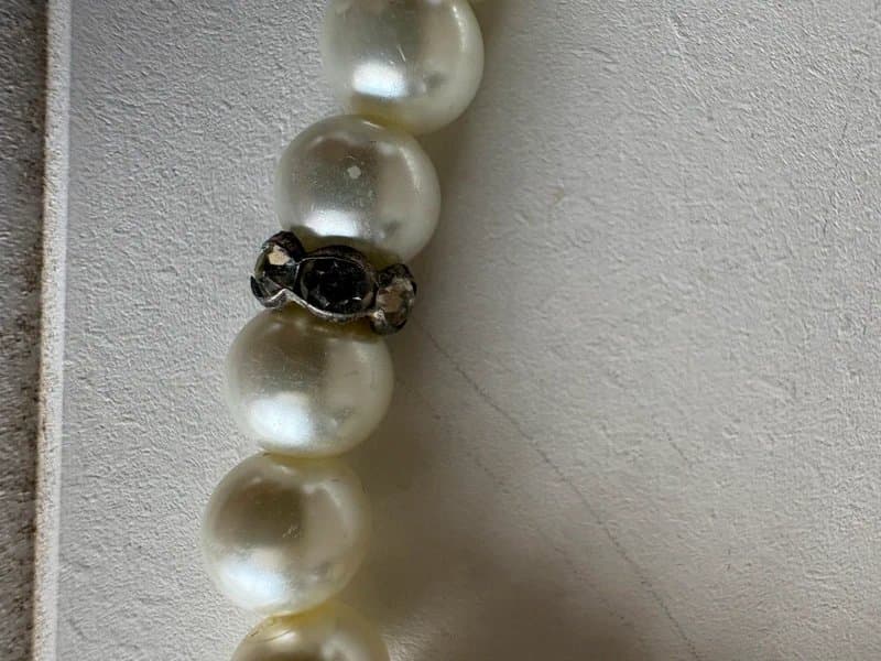 No Label faux pearl bracelet features silver-tone spacers and a decorative clasp
