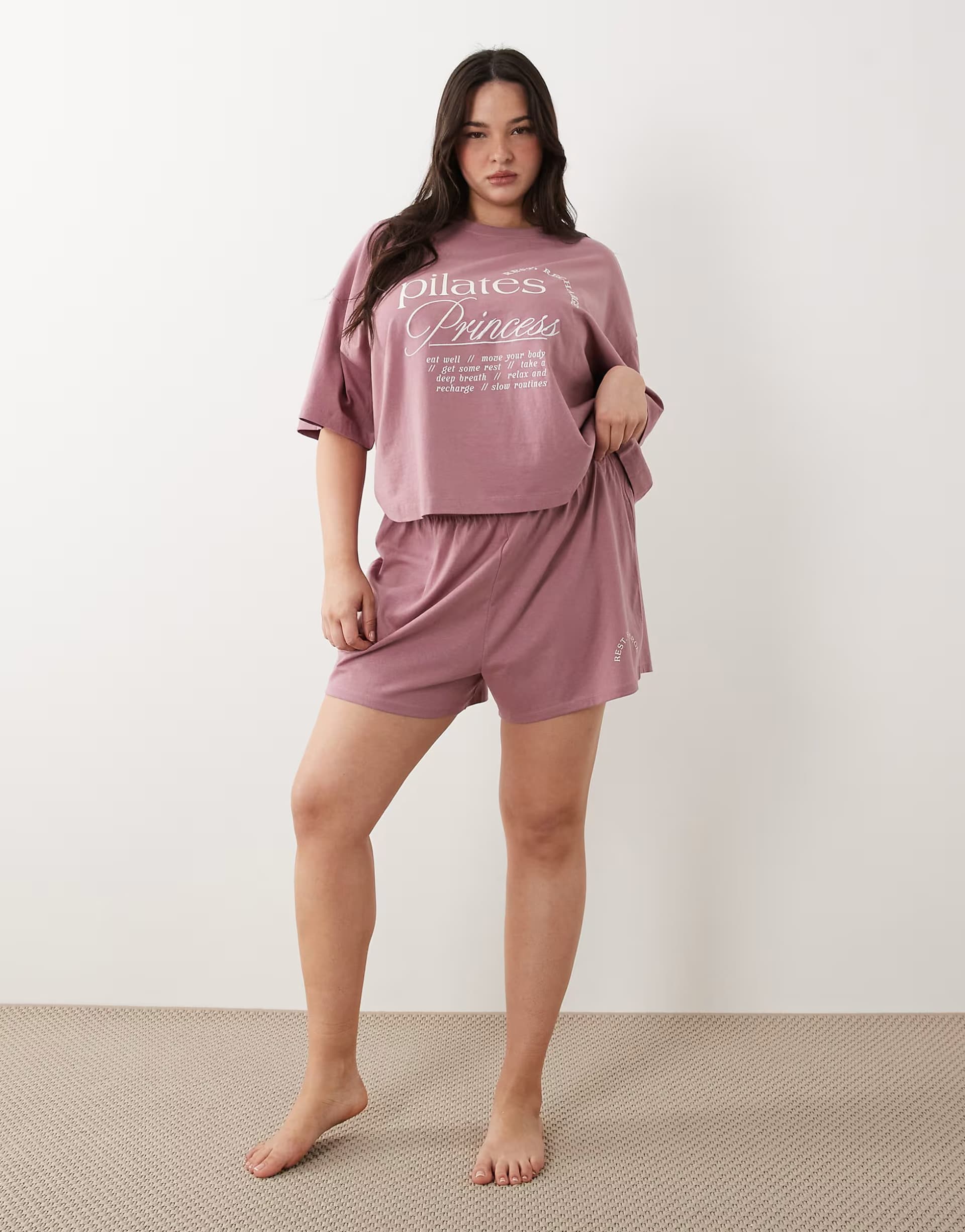 ASOS ASOS DESIGN Curve pilates princess graphic tee and short pyjama set in pink