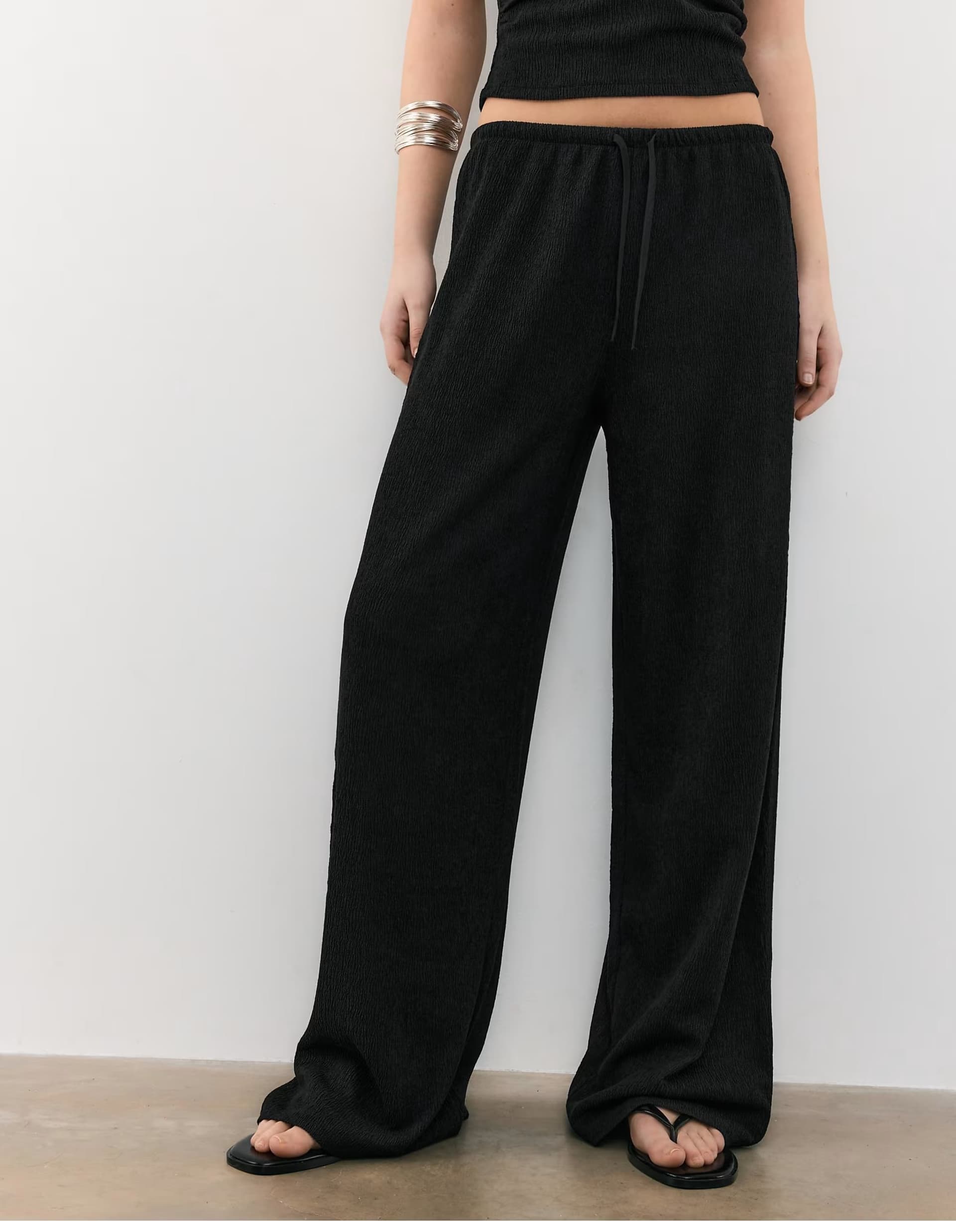 ASOS Stradivarius Flowing creased-effect trousers in black