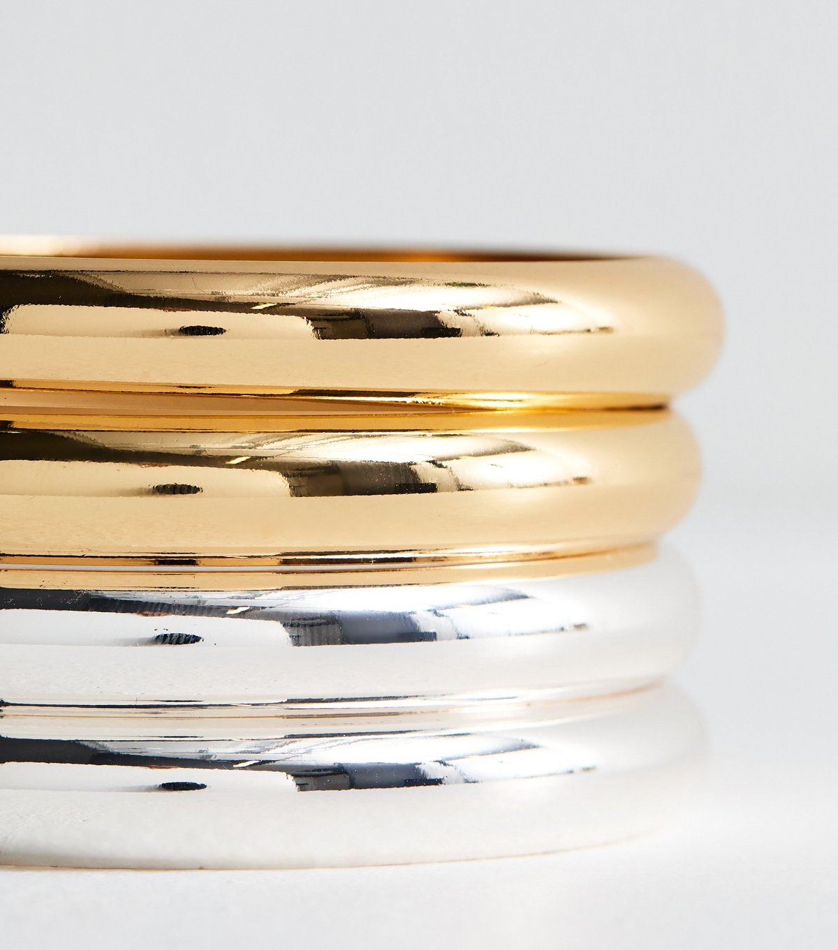 New Look Pack of 4 Silver and Gold Tone Mixed Metal Bangles New Look - 4