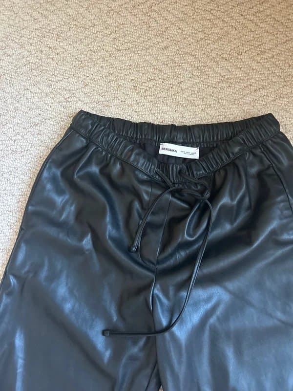 Bershka Black faux leather wide leg trousers