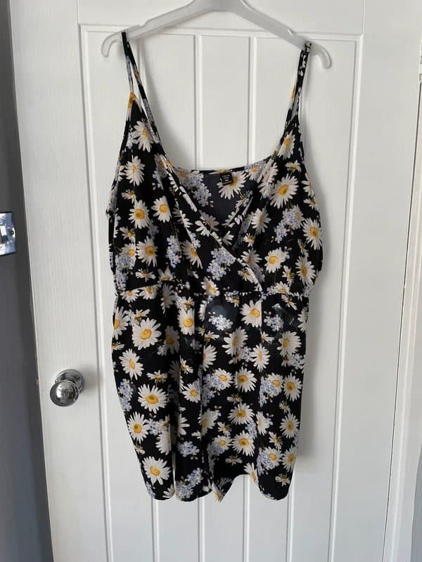 Shein Great play suit black with daisy’s on