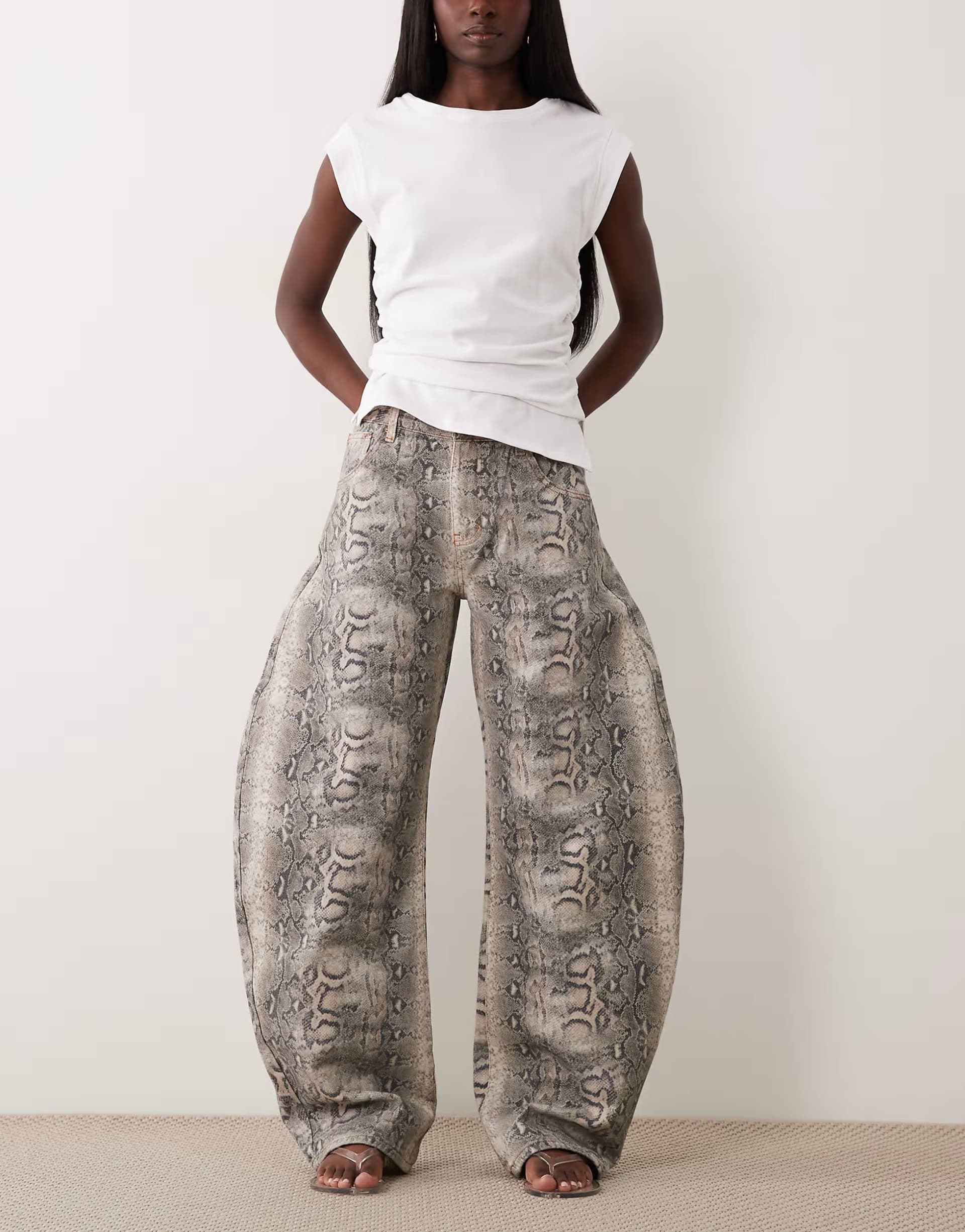 ASOS Lioness Horseshoe barrel leg jeans in snake print