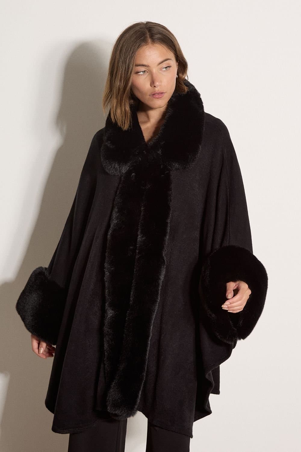 Apricot Apricot Women's Faux Fur Trimmed Cape in Black