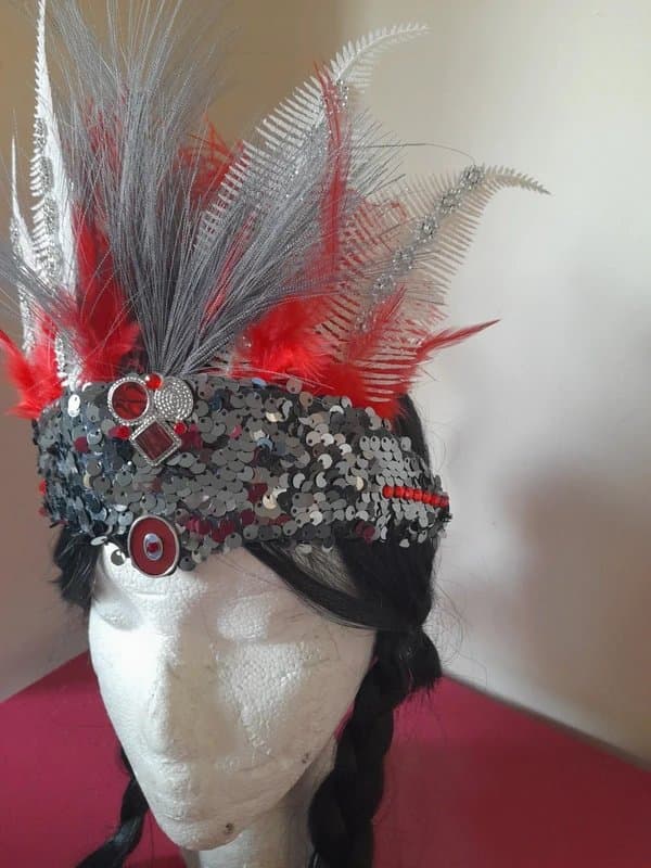 The Unbranded Brand Woman's feather sequin festival headdress to go with your sequin jumpsuit
