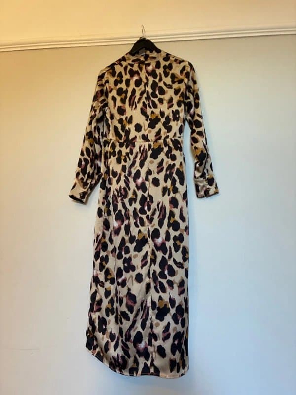 Never Fully Dressed Stunning leopard print wrap around dress with belt. One size.