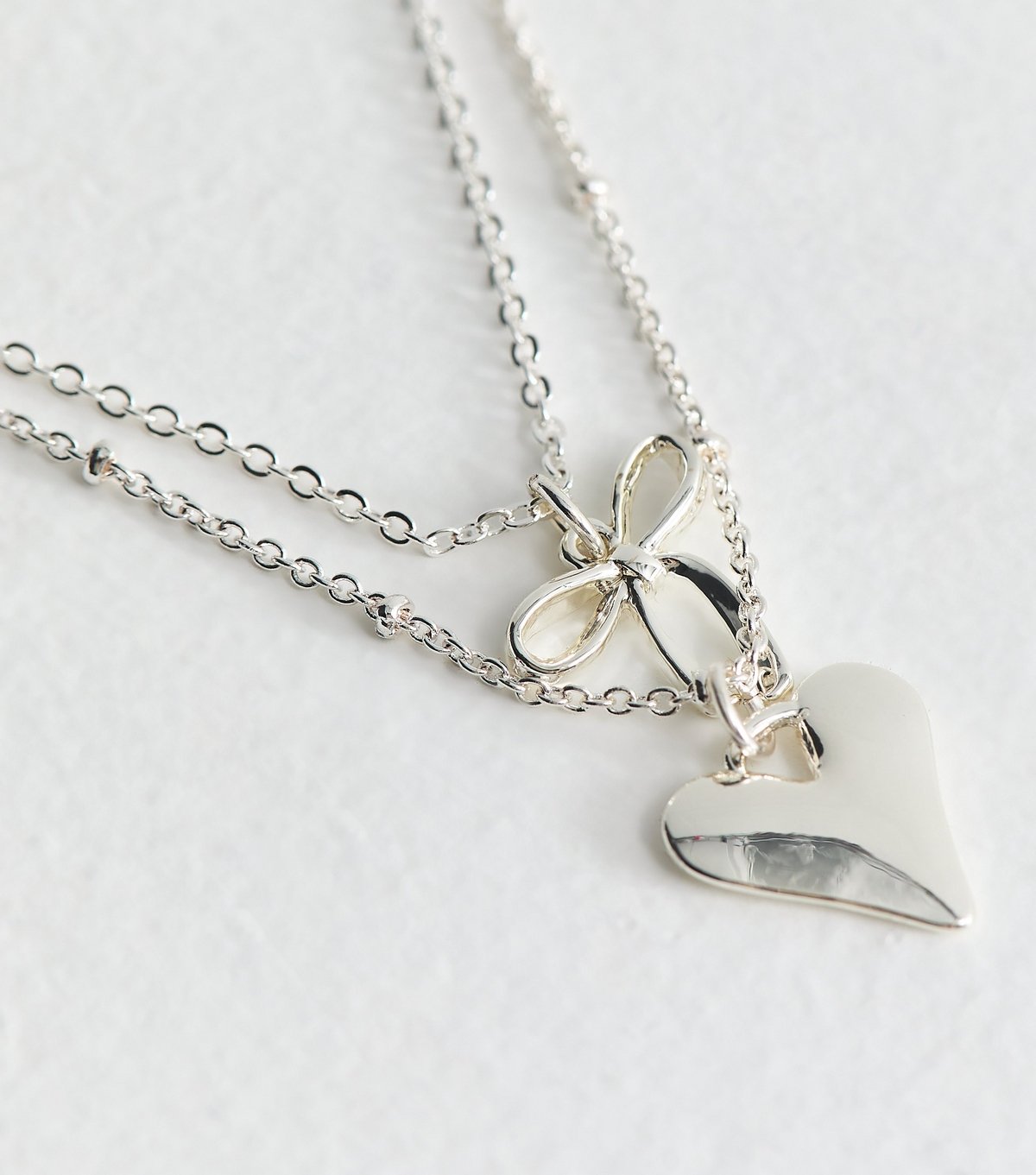 New Look Silver Tone 2 Layer Bow and Heart Pendant Necklace New Look - 4