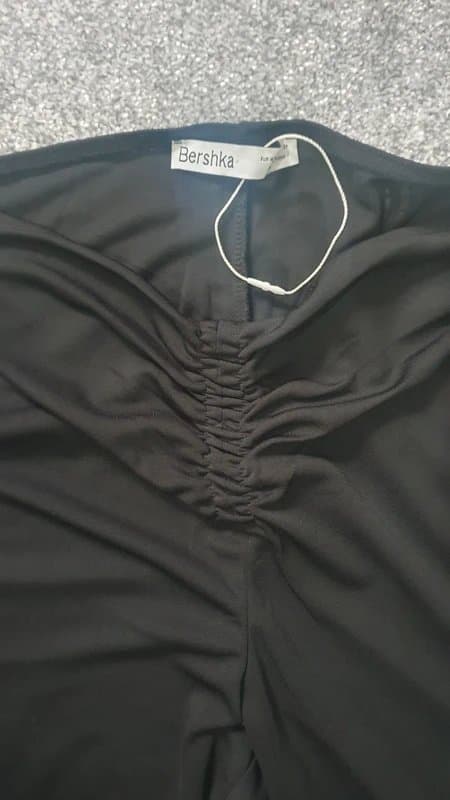 Bershka black flared trousers with a front-ruched waistband o