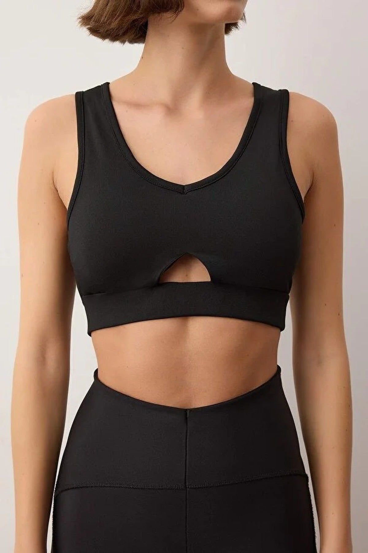 WOVCOR WOVCOR Women's Cut-Out Detail V-Neck Supportive Sports Bra in Black - 2
