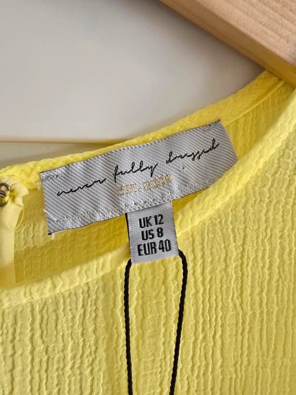 Never Fully Dressed Never Fully Dressed. Yellow chiffon dress. Puff sleeves. Tiered midi. Size 12