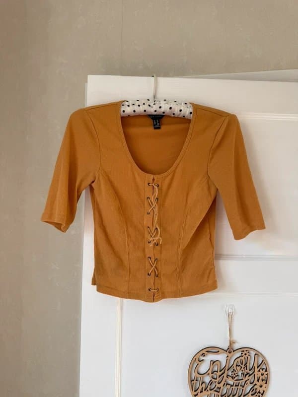 New Look yellow, ribbed New Look top featuring a lace-up front detail size 10