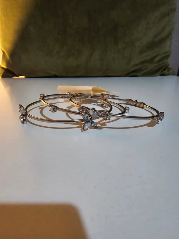 New Look New look set of three silver-toned bangle bracelets with floral details and clear stones