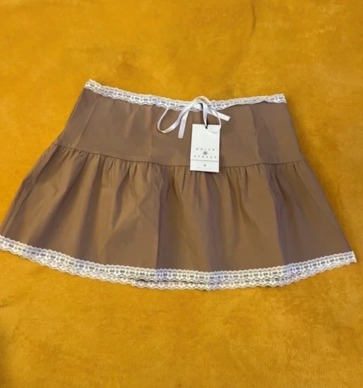 Daisy Street Cute Cute Daisy Street tan ruffle skirt with lace trim and bow