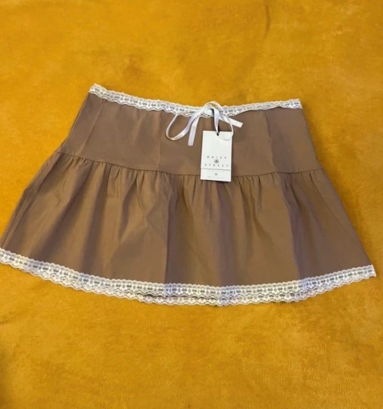 Daisy Street Cute Cute Daisy Street tan ruffle skirt with lace trim and bow - 1