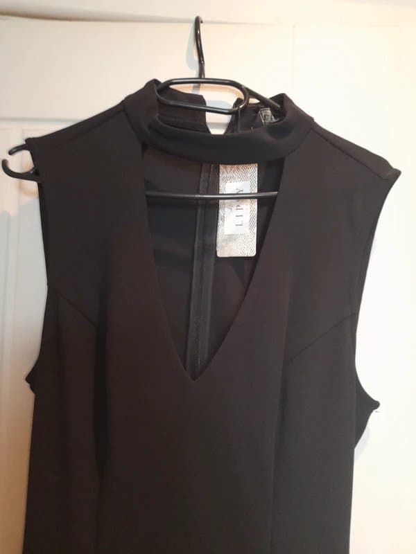 Lipsy Black evening jump suit. Lipsy. Halter neck, back loose belt.