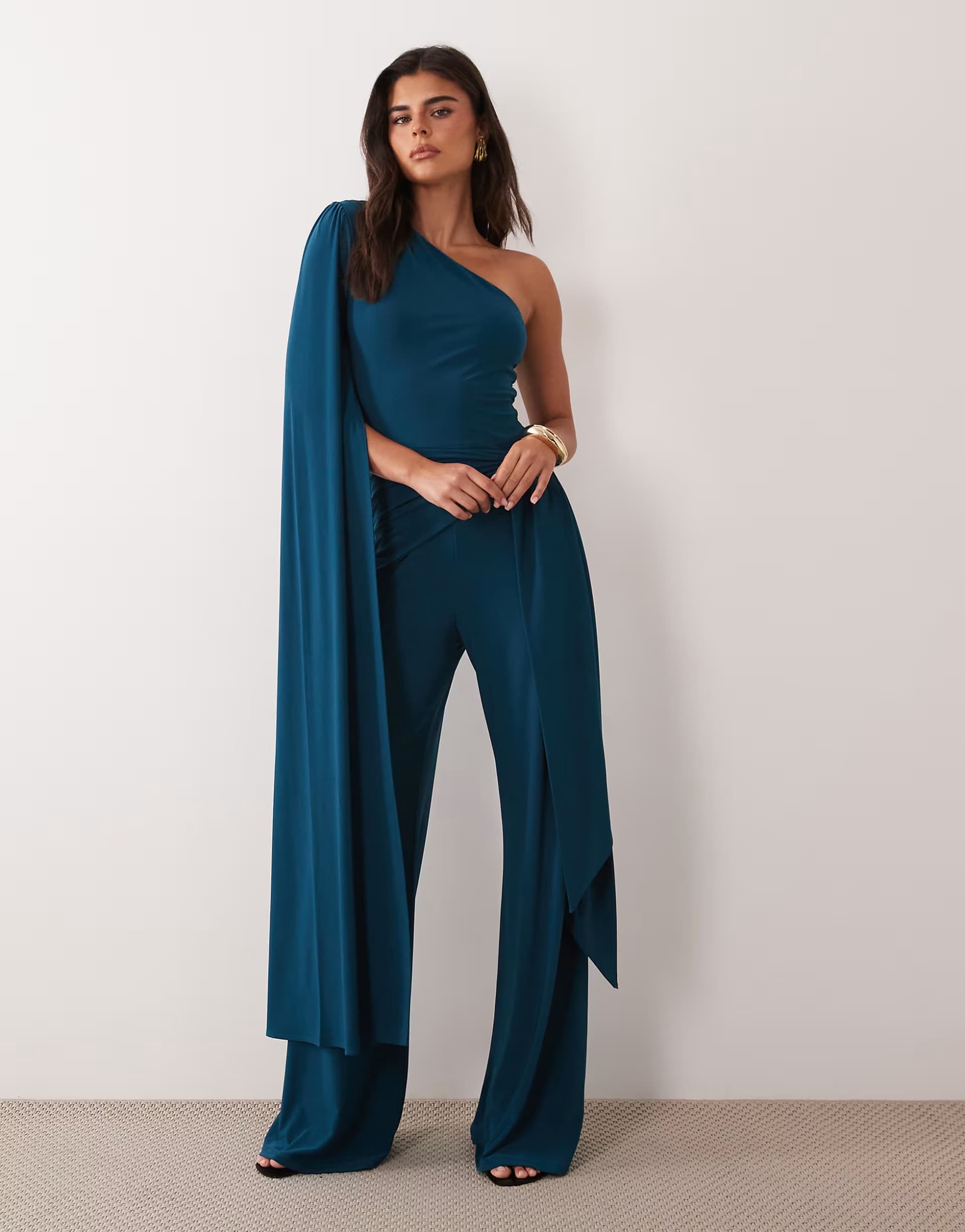ASOS ASOS DESIGN asymmetric one shoulder jumpsuit with sash cape detail and tie in petrol