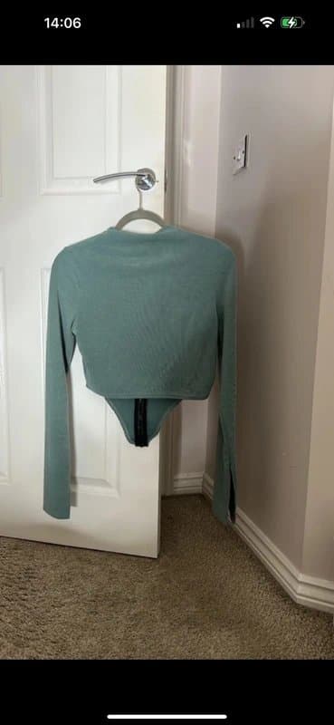 PrettyLittleThing PLT teal green ribbed curved hem split sleeve zip through long sleeve crop top
