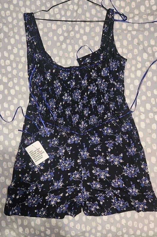 ASOS Lace trim button through spun playsuit in navy floral print with ribbon details and scoop neckline