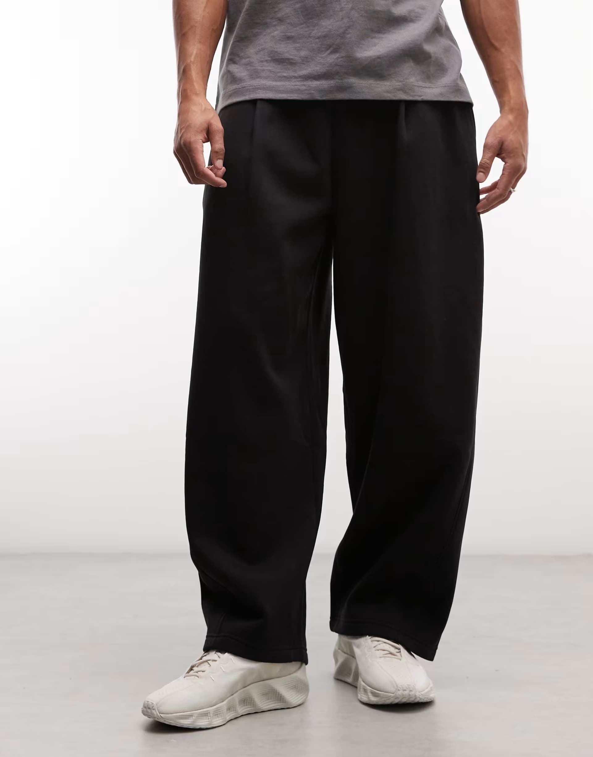 ASOS Weekday wide barrel leg pleated joggers in black