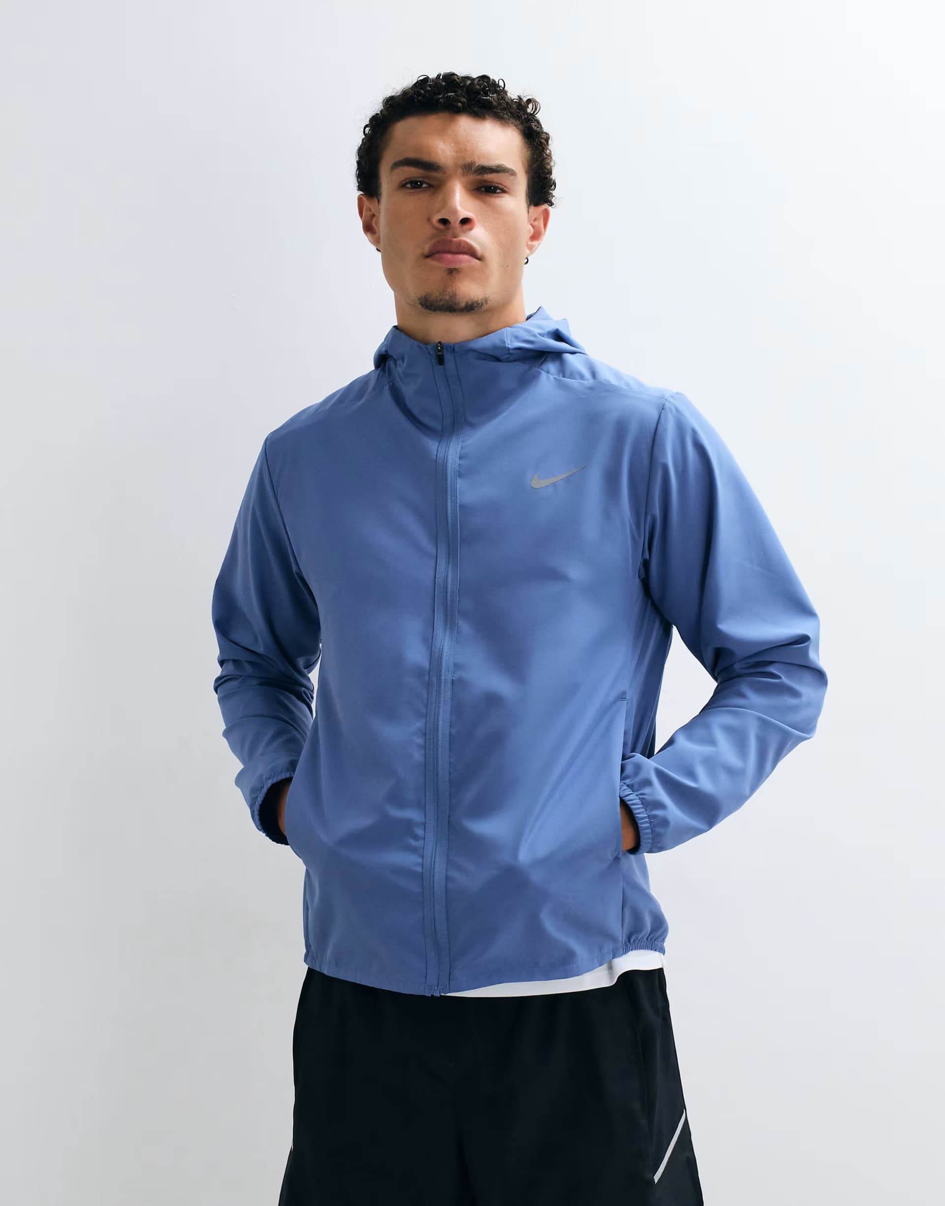 ASOS Nike Training Form Dri-FIT hooded jacket in blue