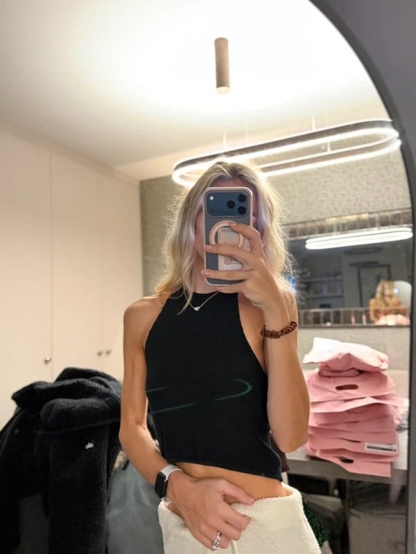 Subdued black halter knit top – size S