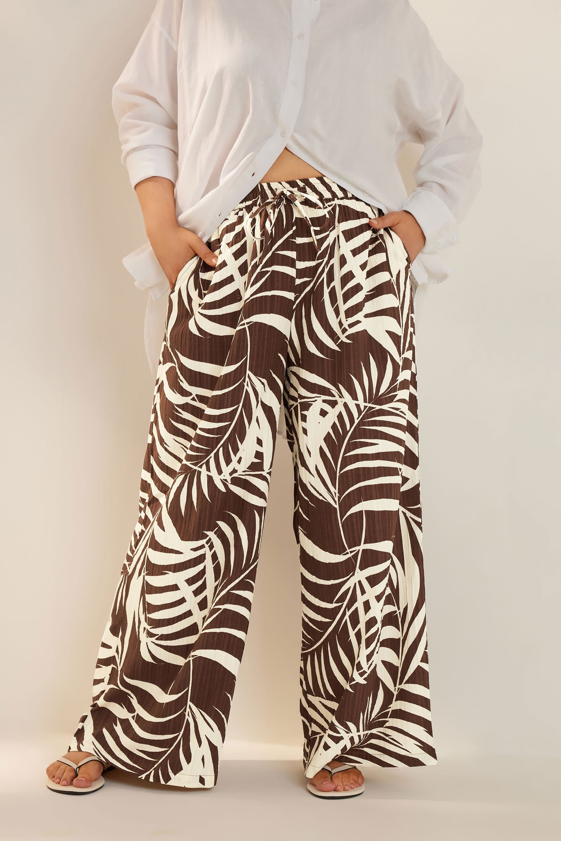 Yours Plus Size Brown Palm Print Textured Wide Leg Trousers