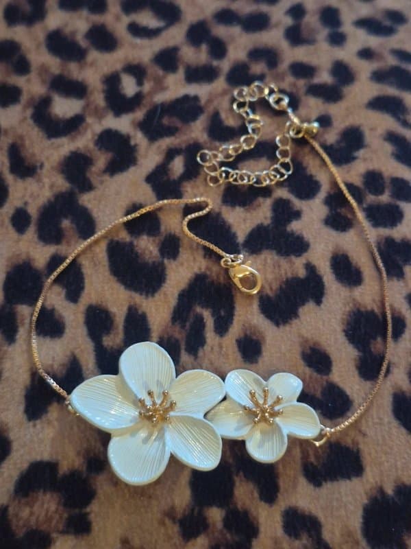 ASOS Asos Gold and white flower choker necklace.