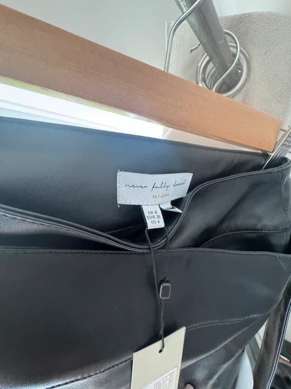 Never Fully Dressed Never fully dressed black leather midi wrap skirt